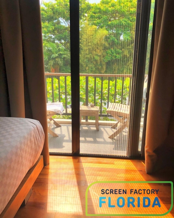 Pleated window screens on wooden windows